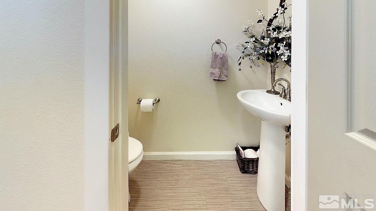 10290 Wolf Ridge Way Reno, NV 89521 - Photo 4 of 22 a bathroom with a shower and a sink