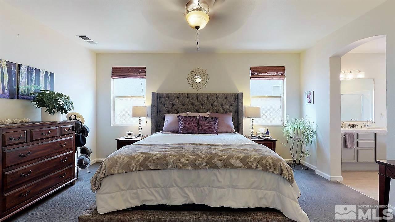 10290 Wolf Ridge Way Reno, NV 89521 - Photo 6 of 22 a bedroom with a bed and window