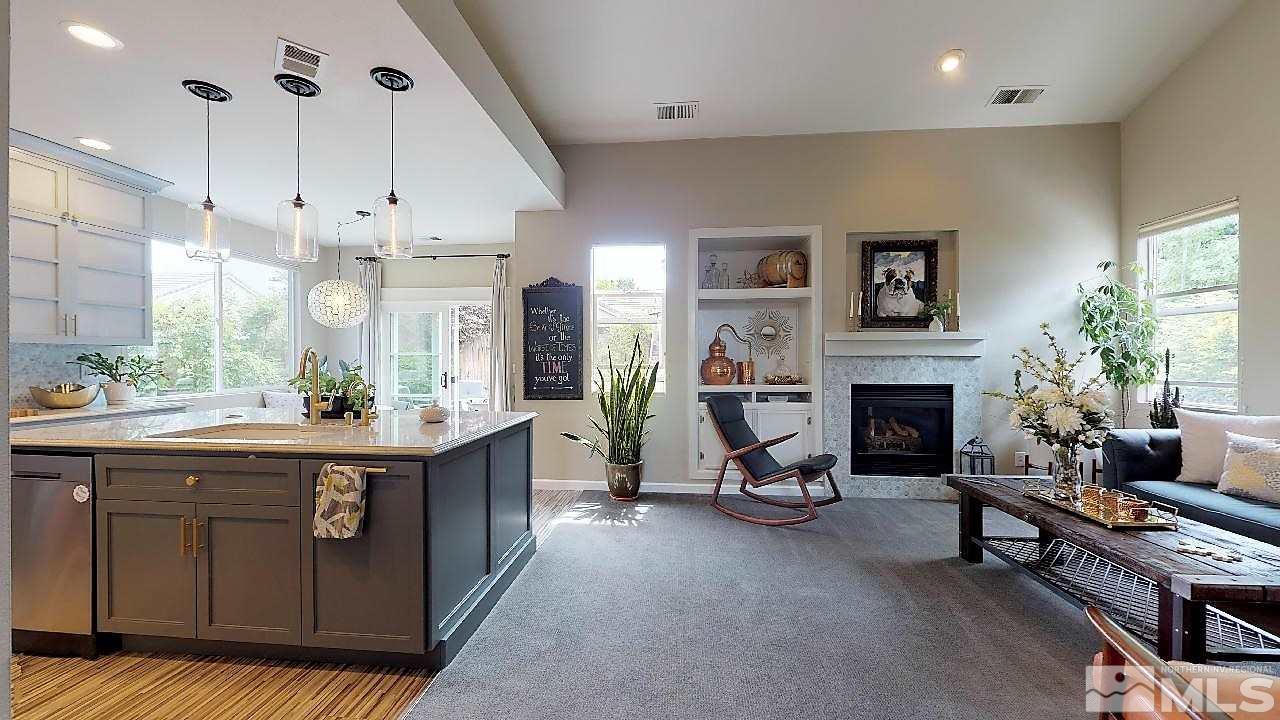 10290 Wolf Ridge Way Reno, NV 89521 - Photo 9 of 22 a large kitchen with cabinets and a fireplace