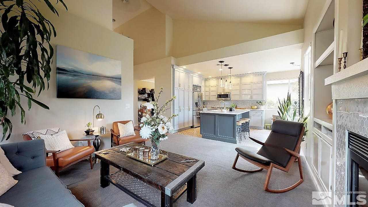10290 Wolf Ridge Way Reno, NV 89521 - Photo 10 of 22 a living room with furniture and a flat screen tv