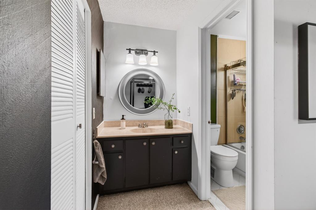 6621 Via Regina, Unit 6621 Boca Raton, FL 33433 - Photo 43 of 100 a view of bathroom with a toilet sink and mirror
