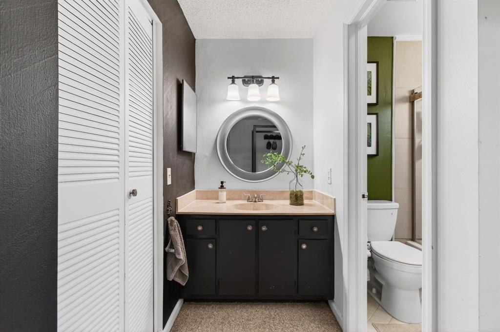 6621 Via Regina, Unit 6621 Boca Raton, FL 33433 - Photo 44 of 100 a bathroom with a toilet a sink and a mirror