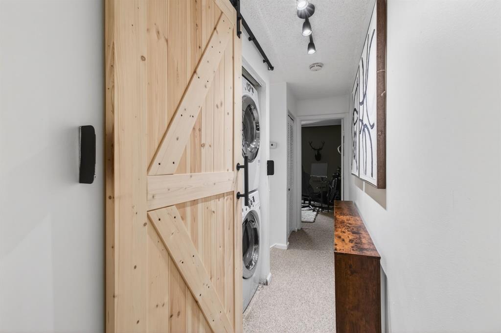 6621 Via Regina, Unit 6621 Boca Raton, FL 33433 - Photo 49 of 100 a view of a hallway with wooden floor and staircase
