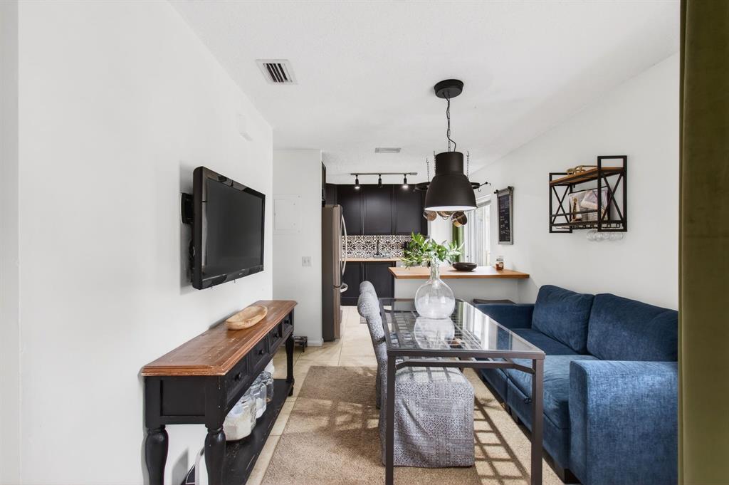 6621 Via Regina, Unit 6621 Boca Raton, FL 33433 - Photo 9 of 100 a living room with furniture and a flat screen tv