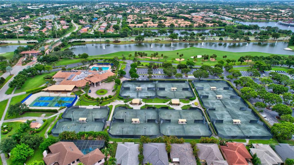 6621 Via Regina, Unit 6621 Boca Raton, FL 33433 - Photo 96 of 100 an aerial view of a house with a swimming pool yard and outdoor seating