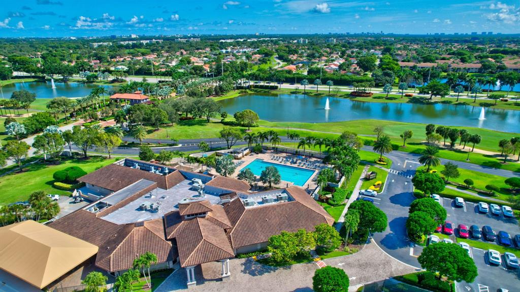 6621 Via Regina, Unit 6621 Boca Raton, FL 33433 - Photo 100 of 100 an aerial view of a houses with a lake view and a mountain