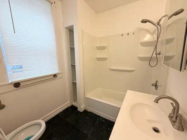 a bathroom with a sink and a shower