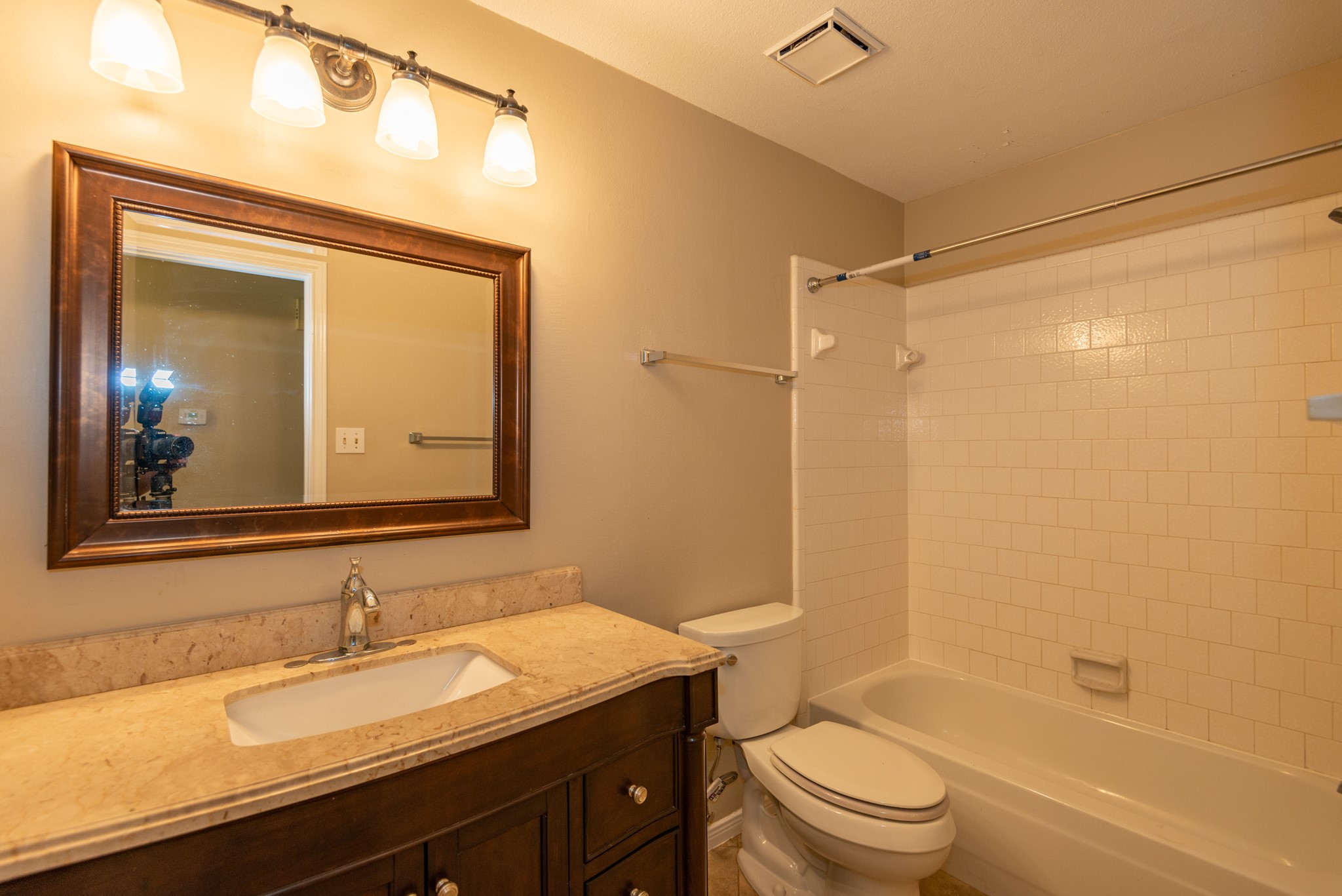 12034 Paddock Way Houston, TX 77065 - Photo 16 of 19 Secondary bath has a beautiful wood vanity with marble top.