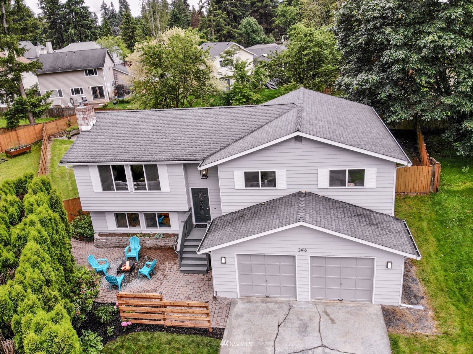 2416 165th Place Southeast Bothell, WA 98012 - Photo 1 of 39 a view of a yard in front of a house