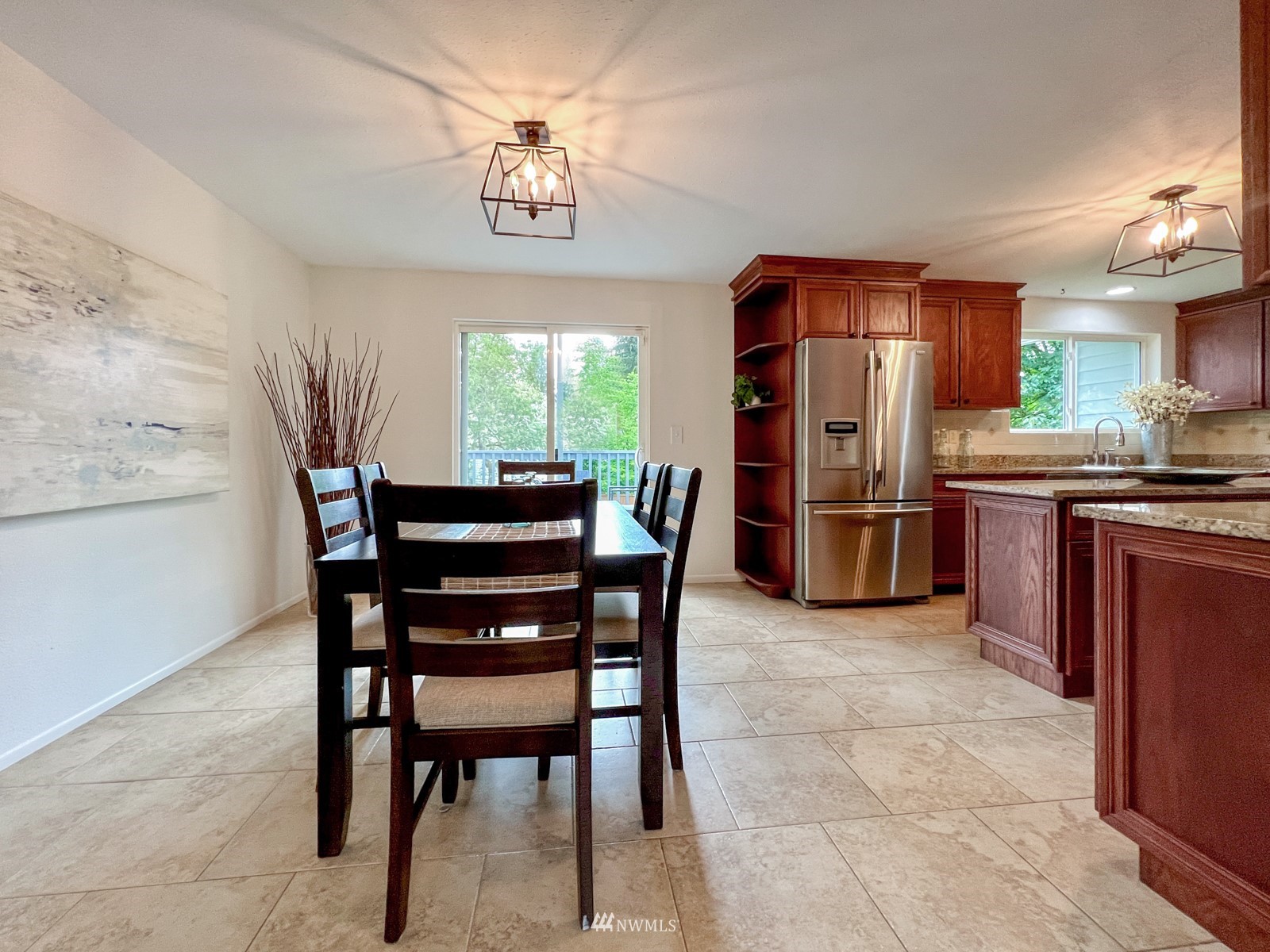 2416 165th Place Southeast Bothell, WA 98012 - Photo 11 of 39 a view of a dining room with furniture and a chandelier