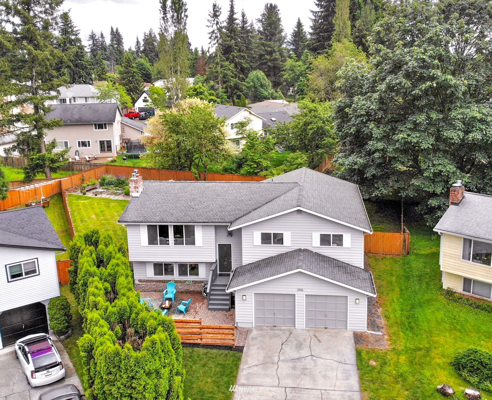 2416 165th Place Southeast Bothell, WA 98012 - Photo 2 of 39 a aerial view of a house with a yard