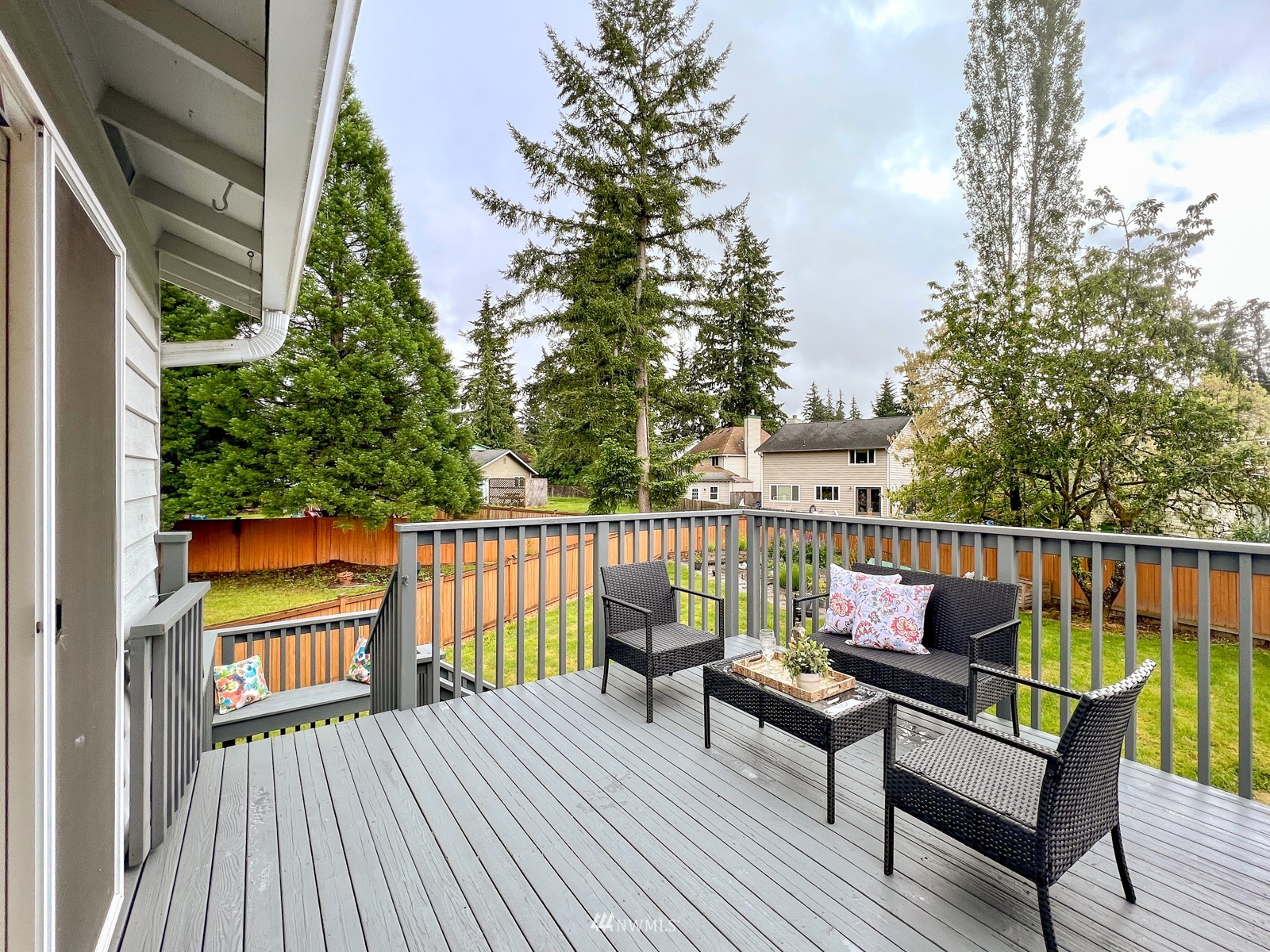 2416 165th Place Southeast Bothell, WA 98012 - Photo 29 of 39 a view of a deck with couches wooden floor and fence
