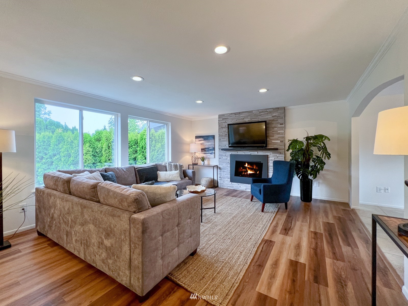 2416 165th Place Southeast Bothell, WA 98012 - Photo 7 of 39 a living room with furniture and a flat screen tv