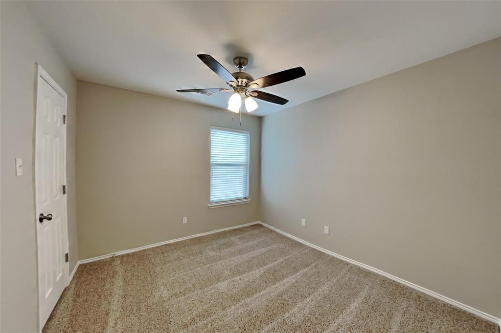 4204 Highgate Road Fort Worth, TX 76244 - Photo 14 of 19 Unfurnished room with light colored carpet and a ceiling fan