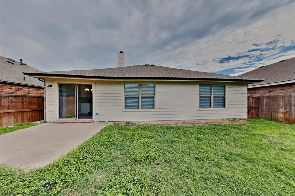 4204 Highgate Road Fort Worth, TX 76244 - Photo 18 of 19 Rear view of house with a fenced backyard, a chimney, and a shingled roof