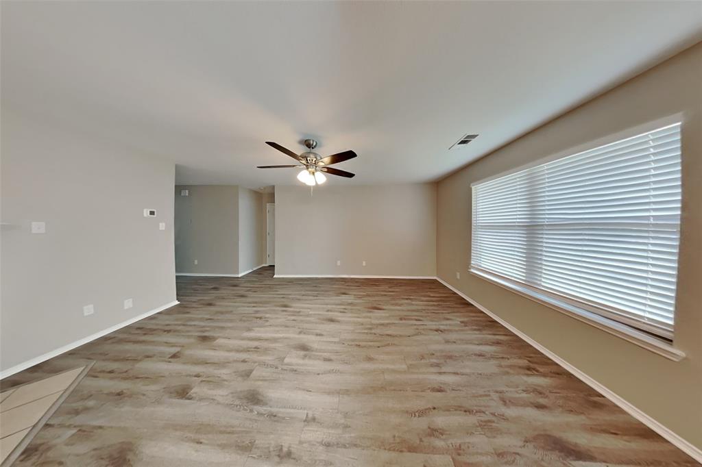 4204 Highgate Road Fort Worth, TX 76244 - Photo 2 of 19 Unfurnished room featuring light wood-style floors and ceiling fan