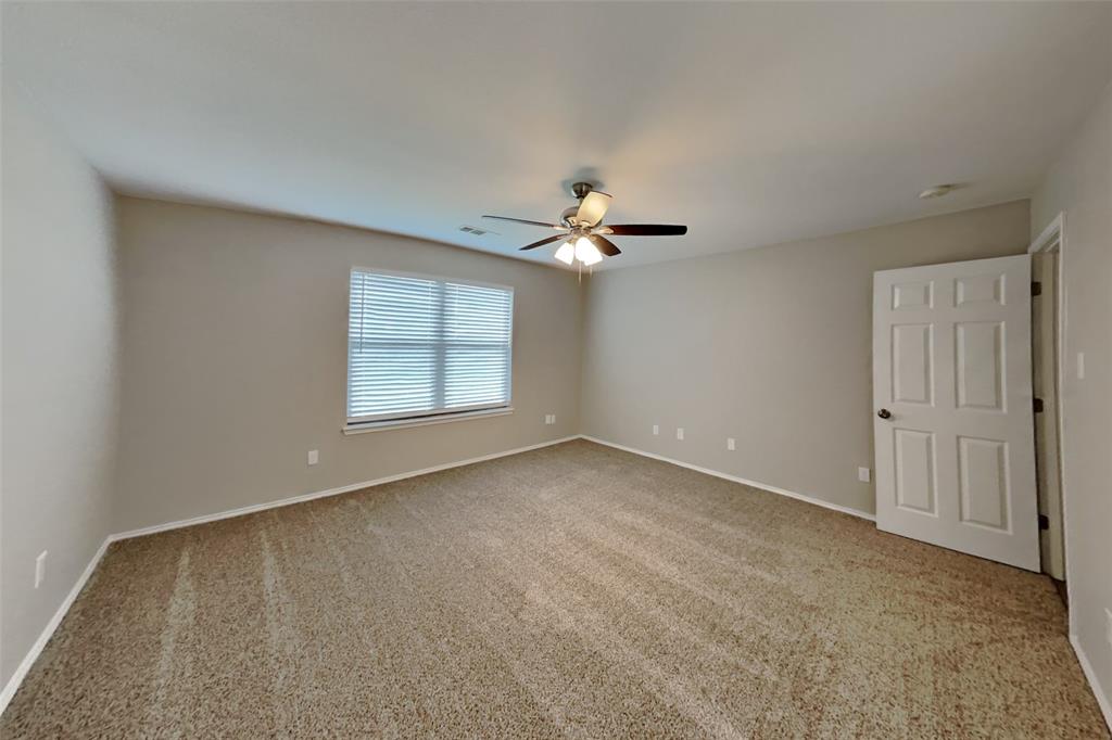 4204 Highgate Road Fort Worth, TX 76244 - Photo 8 of 19 Unfurnished room featuring light colored carpet and a ceiling fan