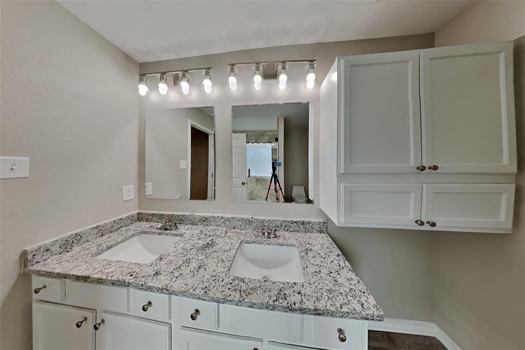 4204 Highgate Road Fort Worth, TX 76244 - Photo 9 of 19 Bathroom featuring double vanity and a textured wall