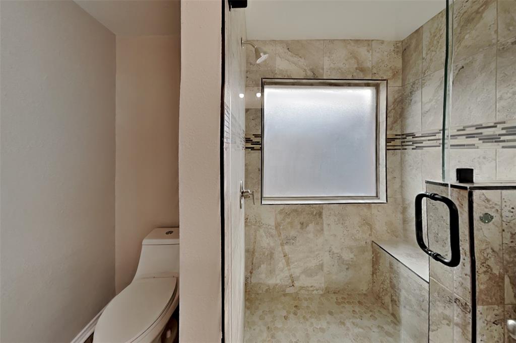 4204 Highgate Road Fort Worth, TX 76244 - Photo 10 of 19 Bathroom featuring a stall shower and toilet