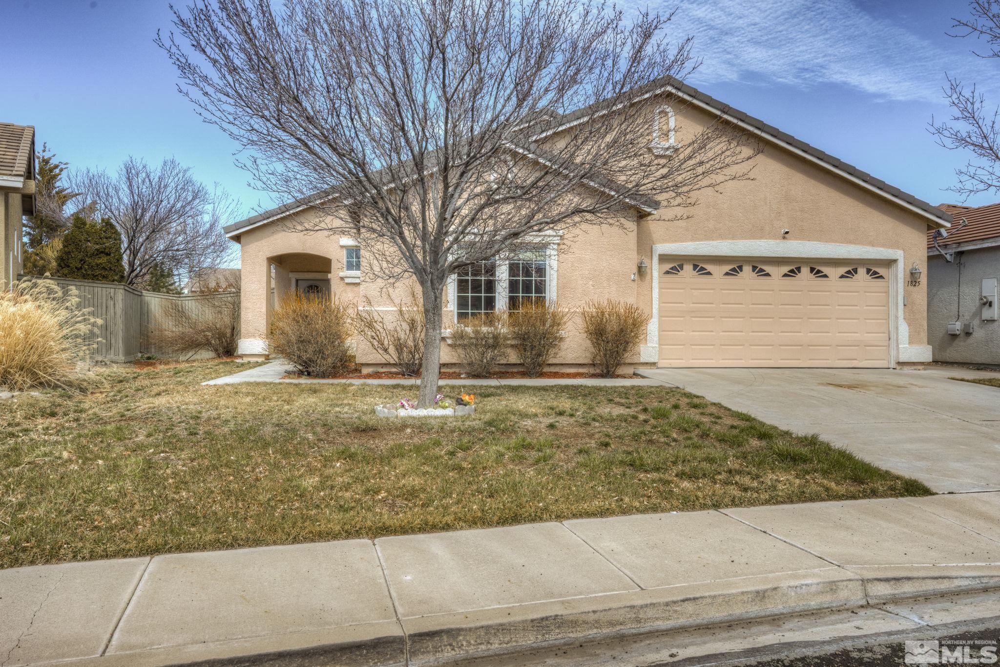 1825 D'Arques Court Reno, NV 89521 - Photo 2 of 40 a front view of a house with a yard