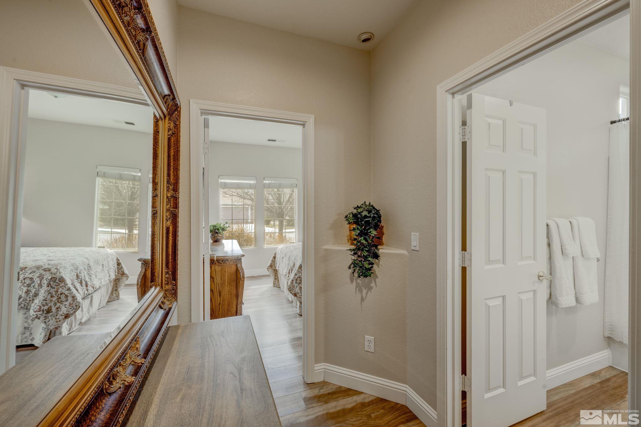 1825 D'Arques Court Reno, NV 89521 - Photo 27 of 40 a view of a bedroom with wooden floor
