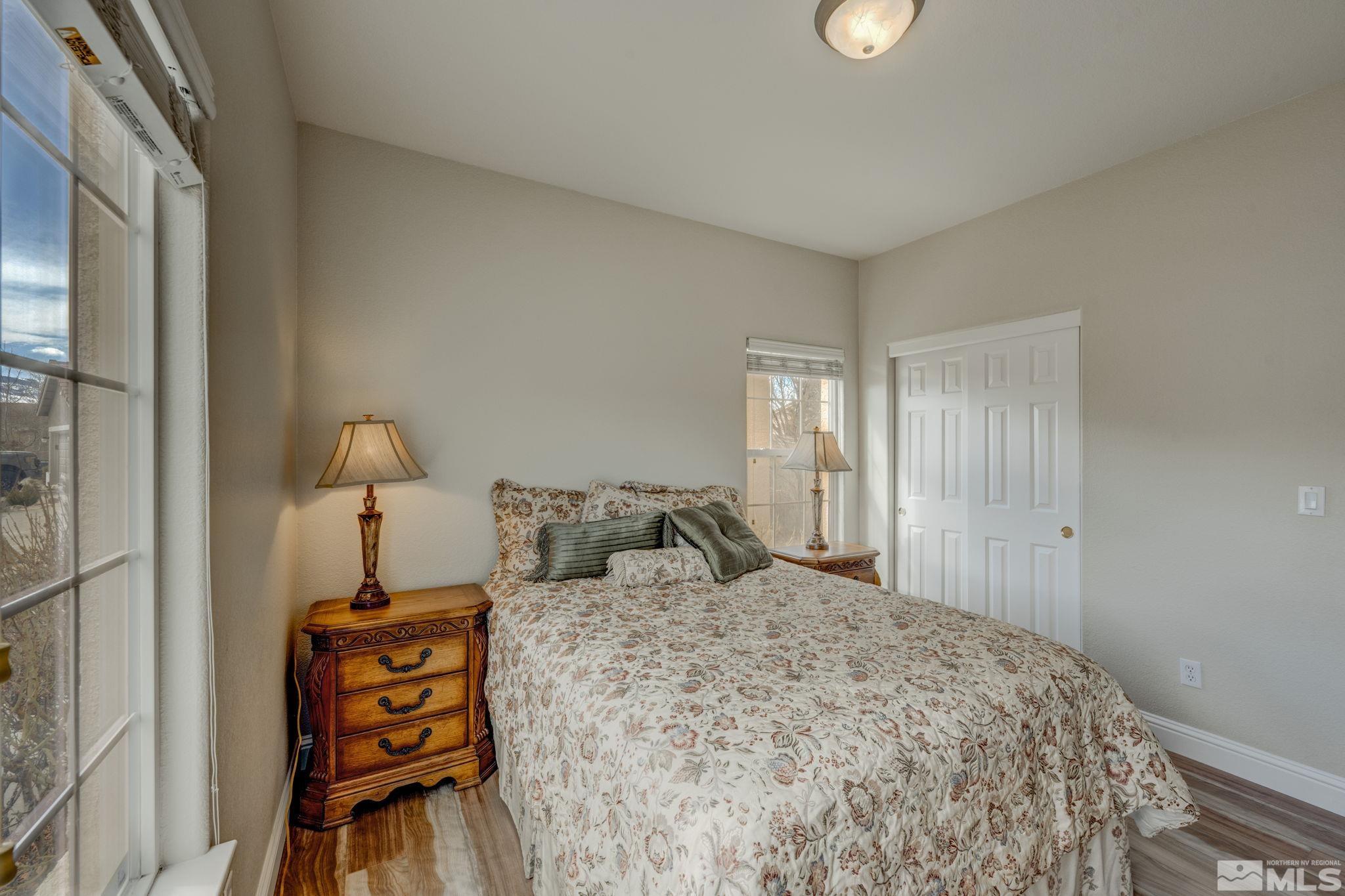 1825 D'Arques Court Reno, NV 89521 - Photo 30 of 40 a bedroom with a bed and a window