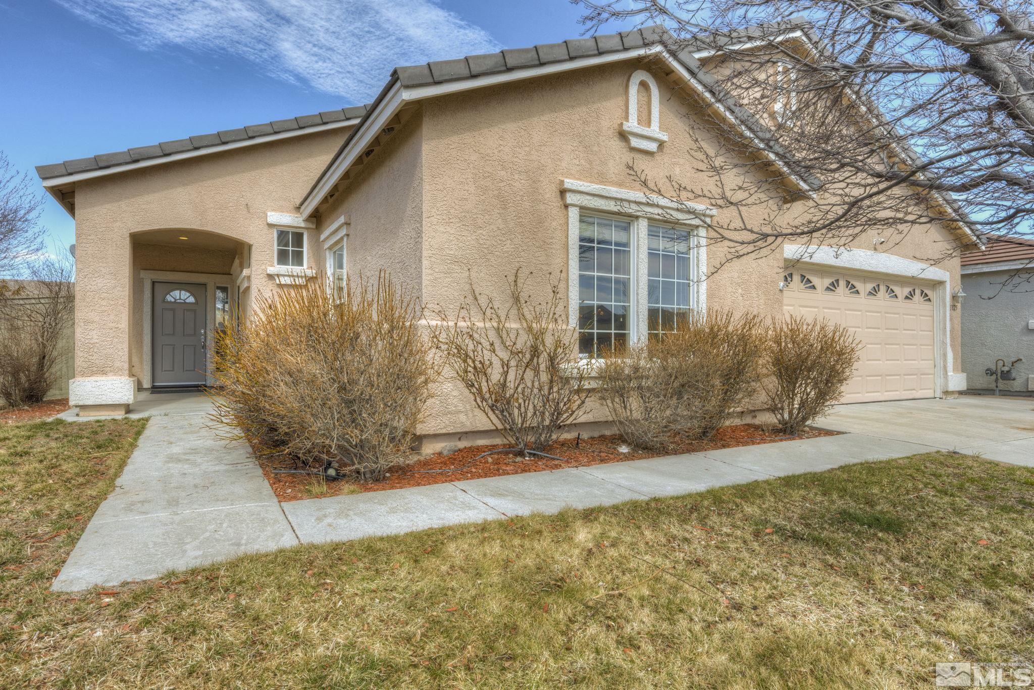 1825 D'Arques Court Reno, NV 89521 - Photo 3 of 40 a front view of a house with a yard