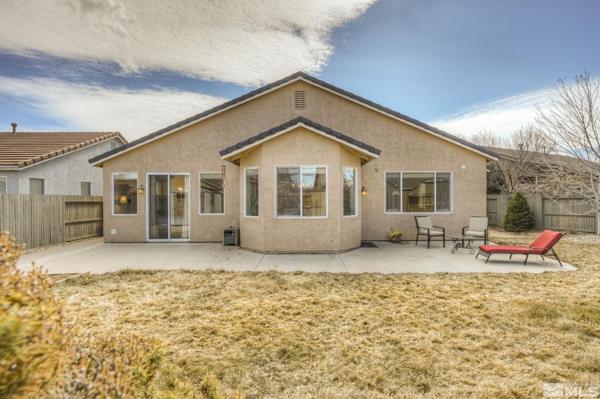 1825 D'Arques Court Reno, NV 89521 - Photo 32 of 40 a front view of a house with patio