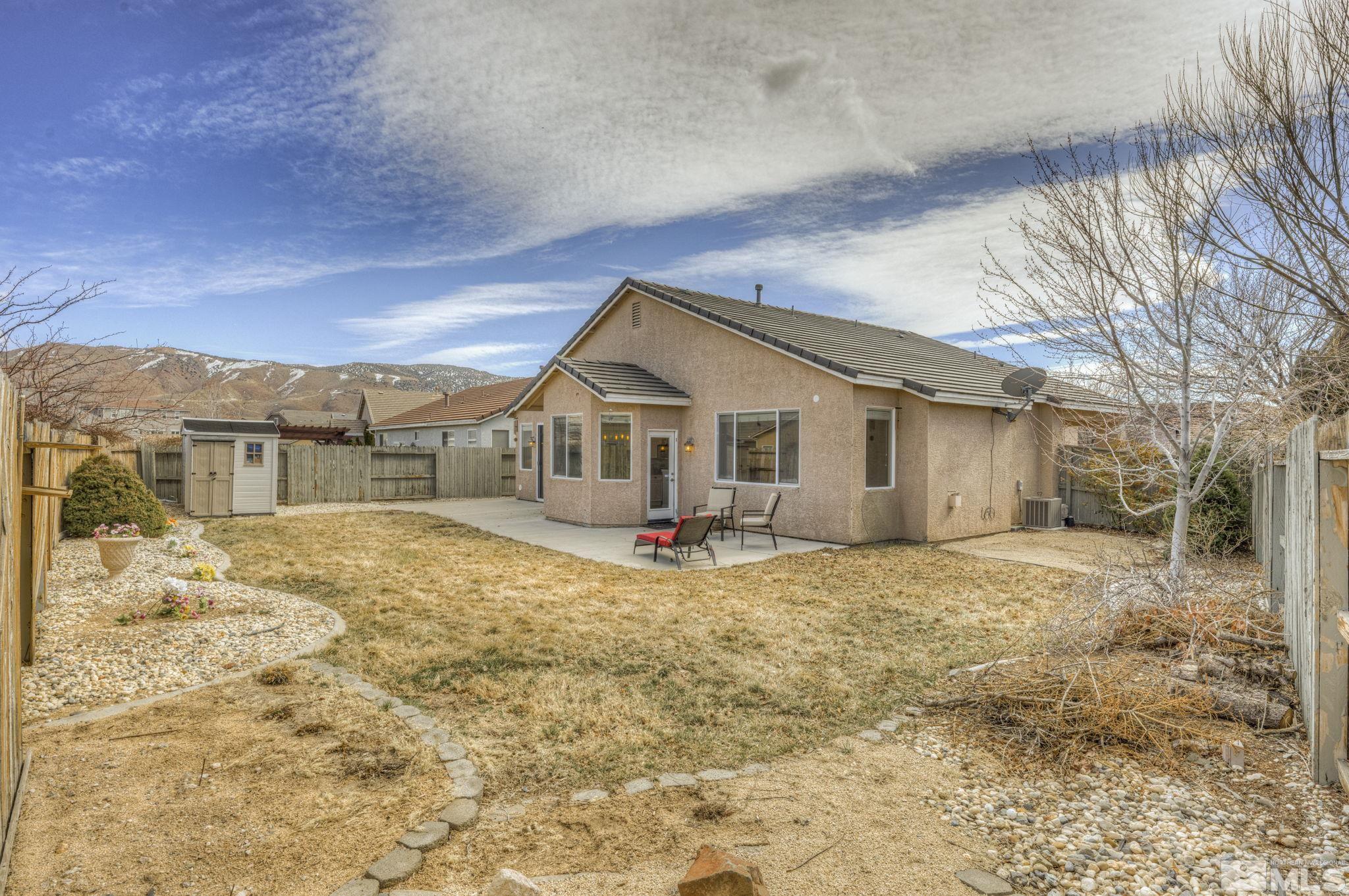 1825 D'Arques Court Reno, NV 89521 - Photo 33 of 40 a view of a house with wooden fence