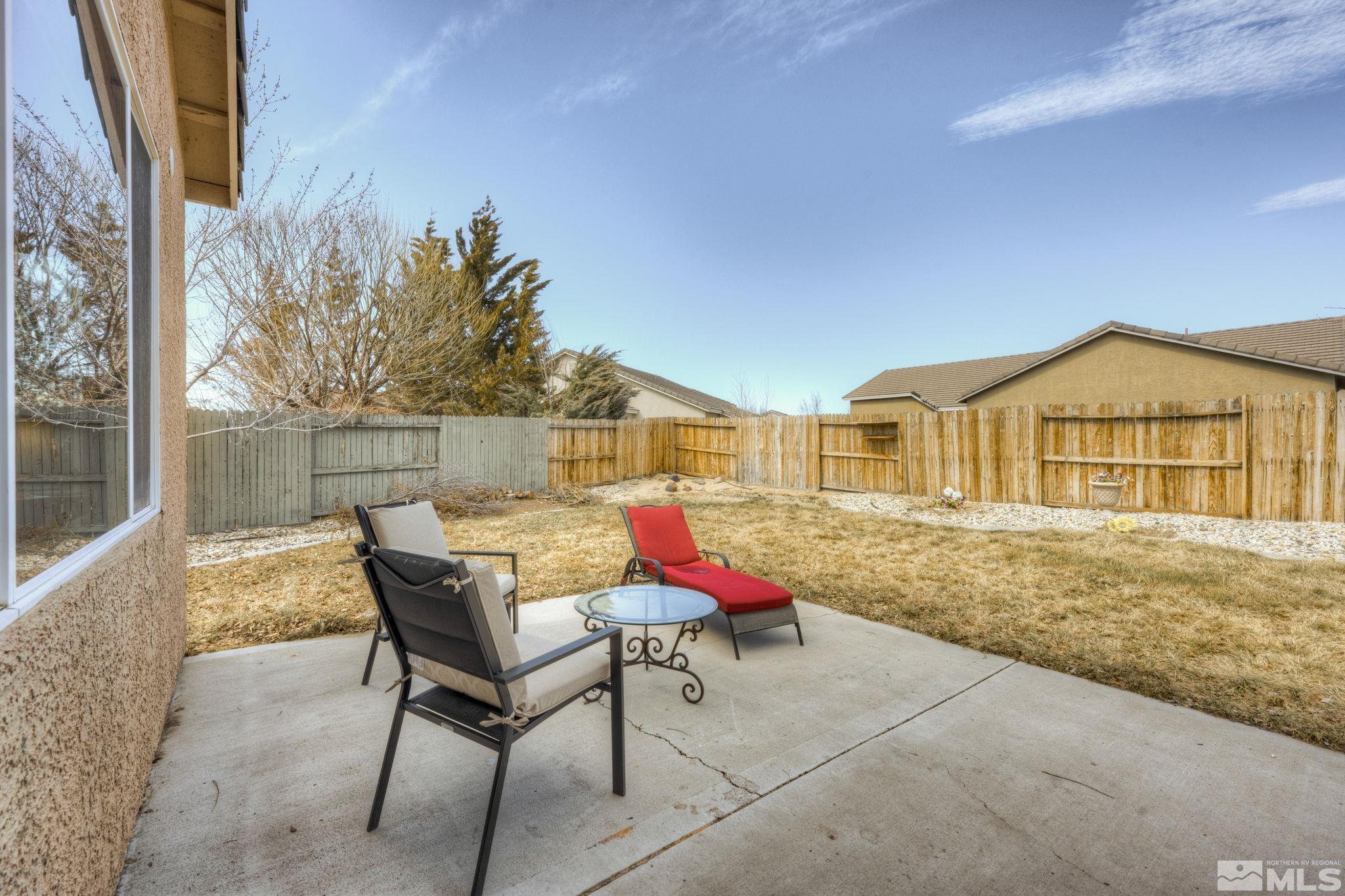 1825 D'Arques Court Reno, NV 89521 - Photo 34 of 40 a view of a house with backyard porch and sitting area