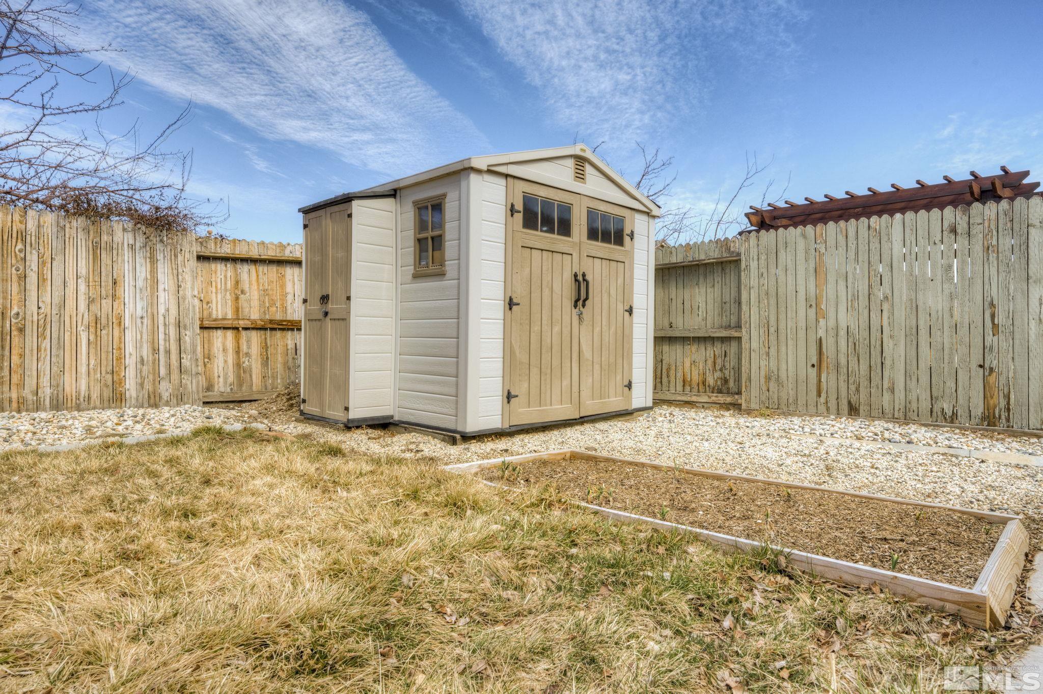1825 D'Arques Court Reno, NV 89521 - Photo 37 of 40 a view of a house with a backyard