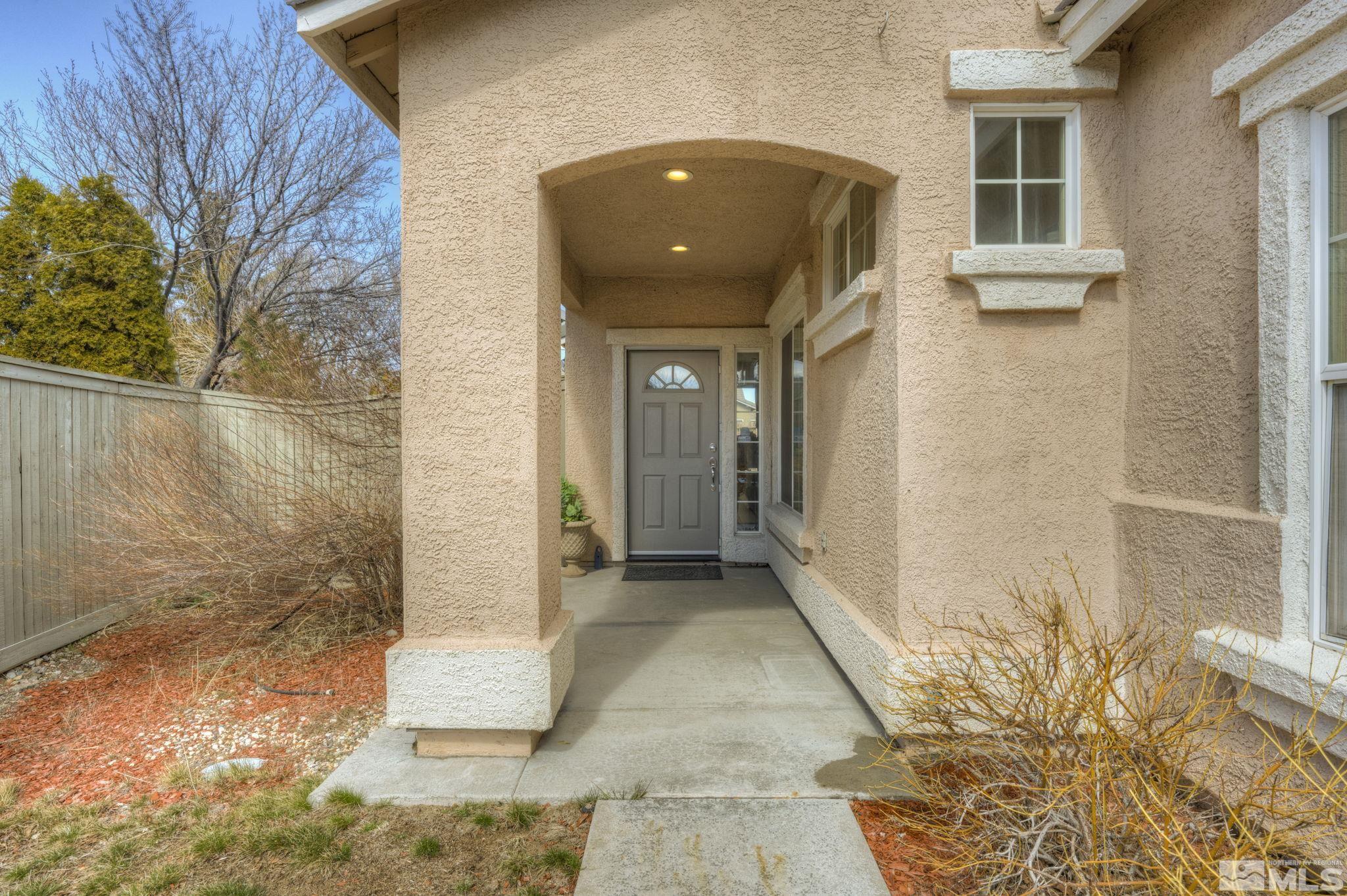 1825 D'Arques Court Reno, NV 89521 - Photo 4 of 40 a front view of a house with a shower