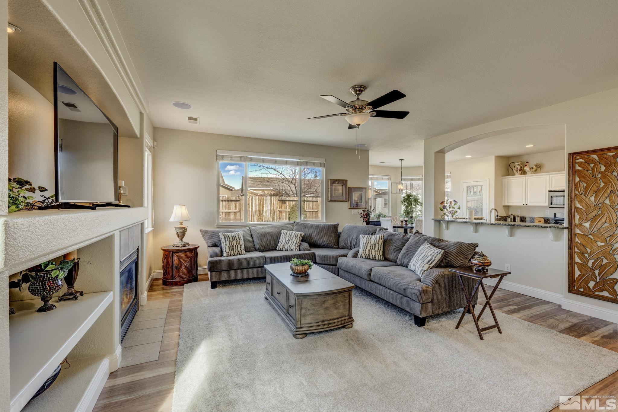 1825 D'Arques Court Reno, NV 89521 - Photo 6 of 40 a living room with furniture and a fireplace