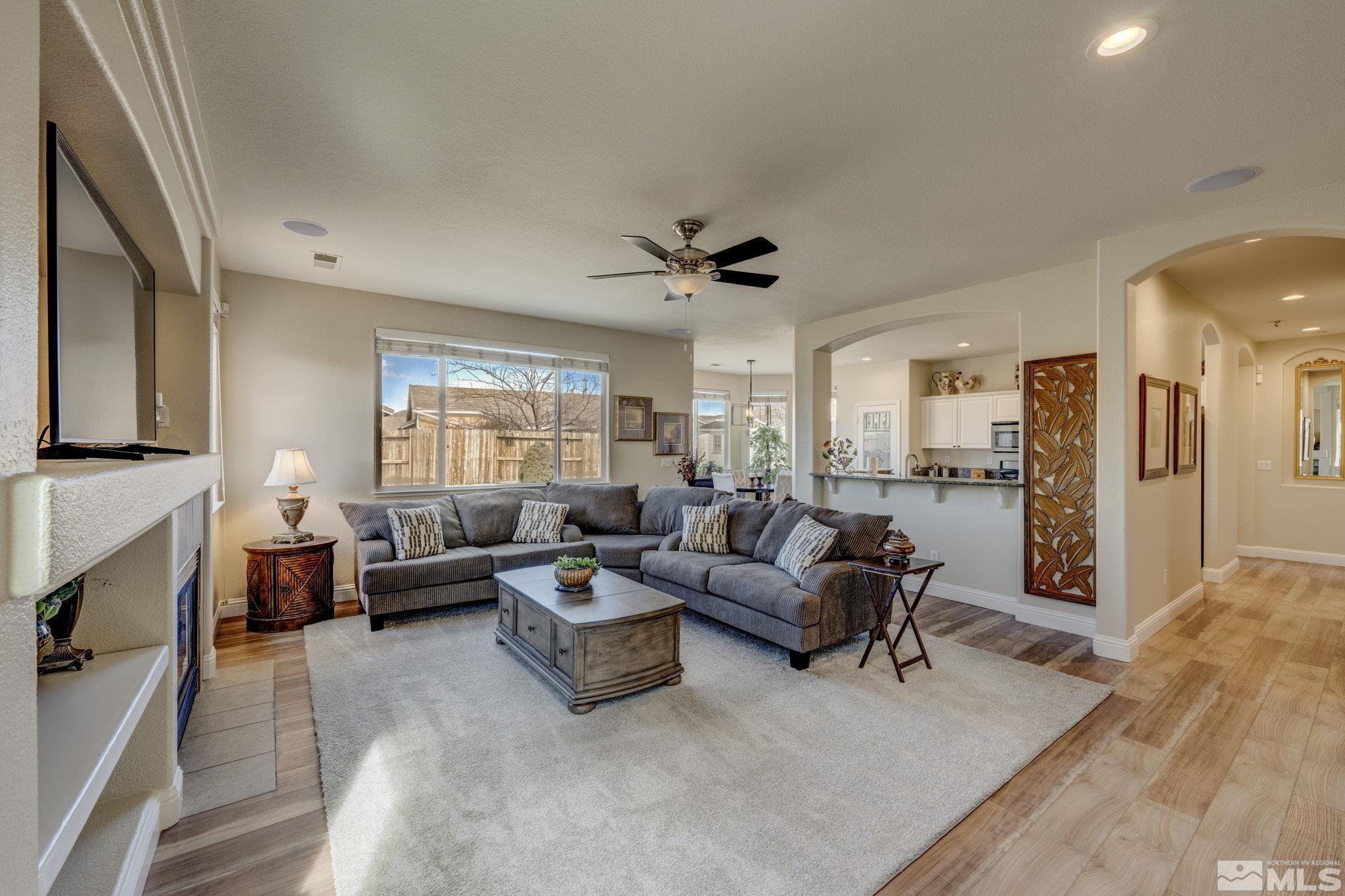 1825 D'Arques Court Reno, NV 89521 - Photo 7 of 40 a living room with furniture and a fireplace