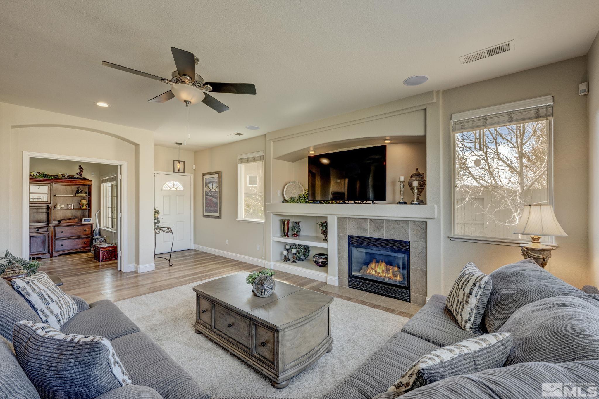 1825 D'Arques Court Reno, NV 89521 - Photo 9 of 40 a living room with furniture and a fireplace