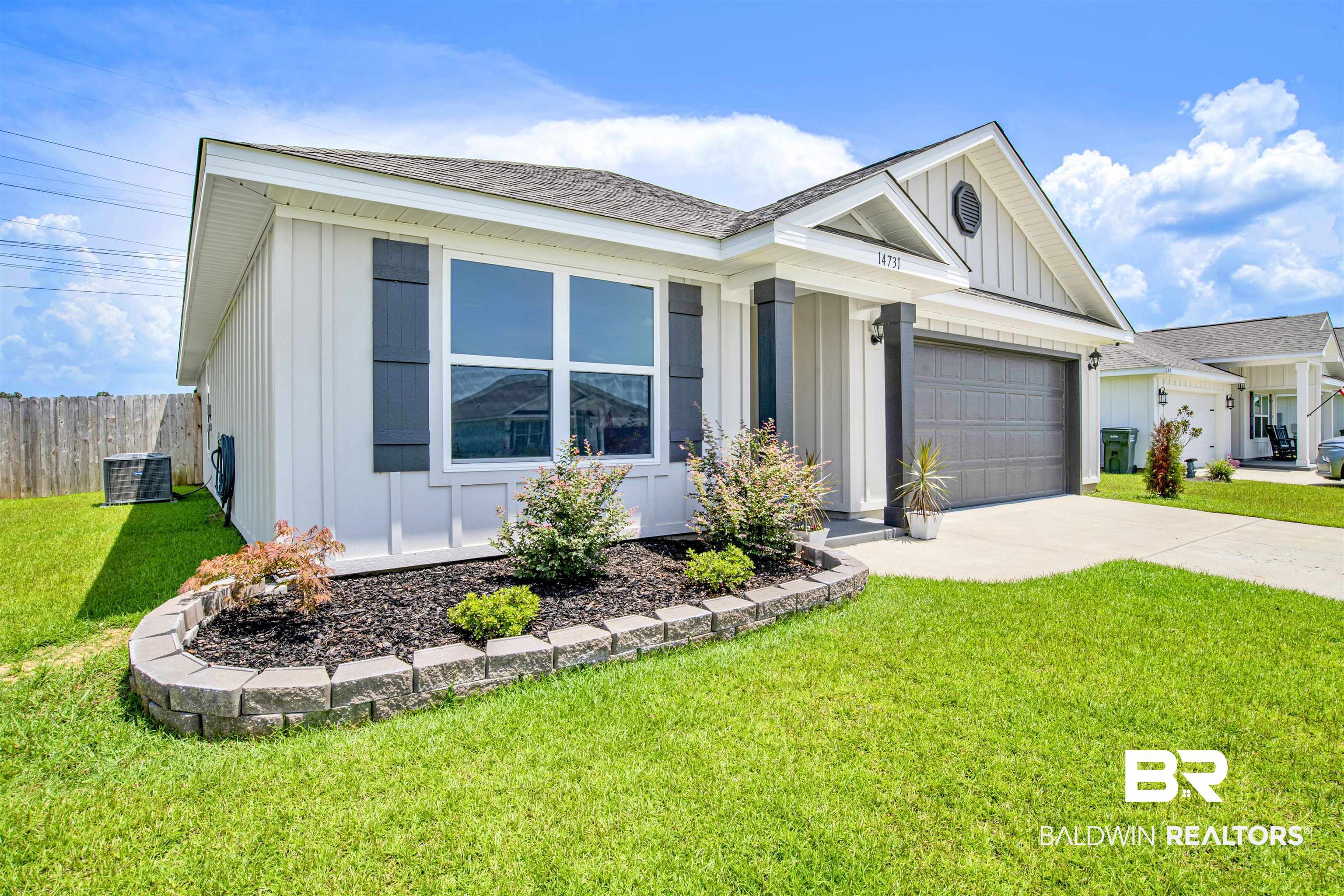 14731 Forsythia Loop Silverhill, AL 36576 - Photo 24 of 25 Single story home with a garage and a front yard