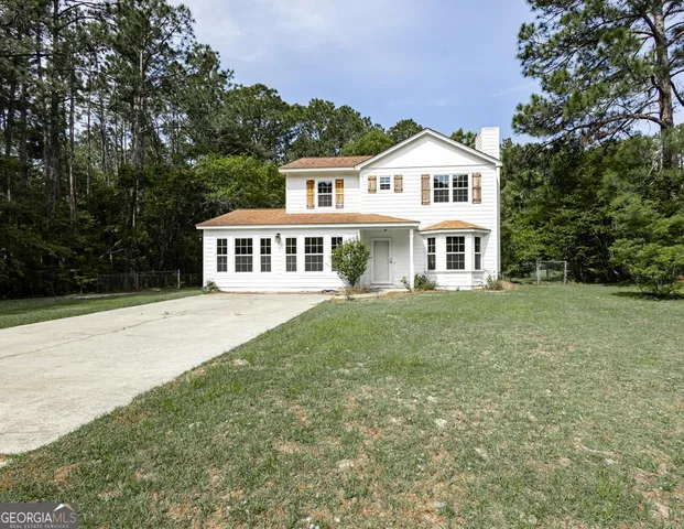 a house view with a garden space