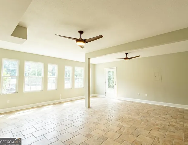 a view of an empty room and window