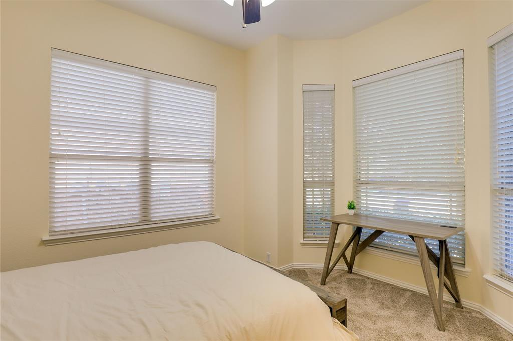 4502 Ridgeway Drive Mansfield, TX 76063 - Photo 22 of 29 a bedroom with a bed and a window