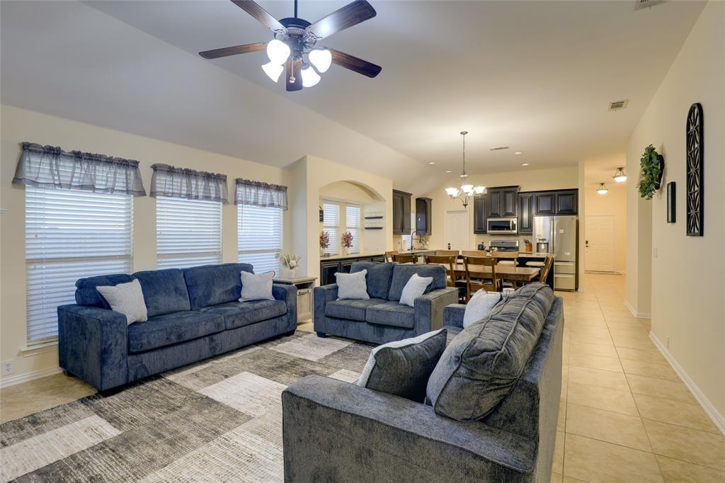 4502 Ridgeway Drive Mansfield, TX 76063 - Photo 7 of 29 a living room with furniture kitchen view and a chandelier