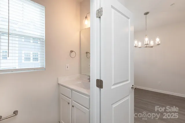a bathroom with a shower and a sink