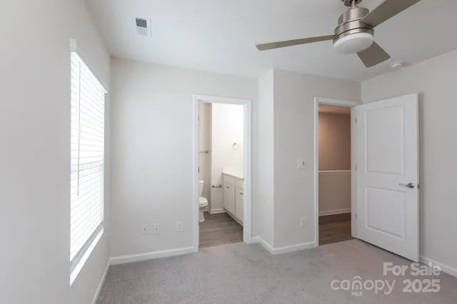 a view of room with windows and bathroom view