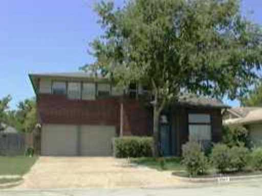 5507 Teri Road Austin, TX 78744 - Photo 1 of 1 a front view of a house with garden