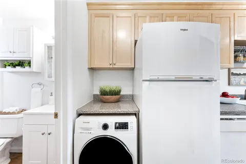 a white refrigerator freezer sitting inside of a kitchen