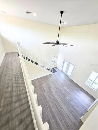 a view of a room with wooden floor