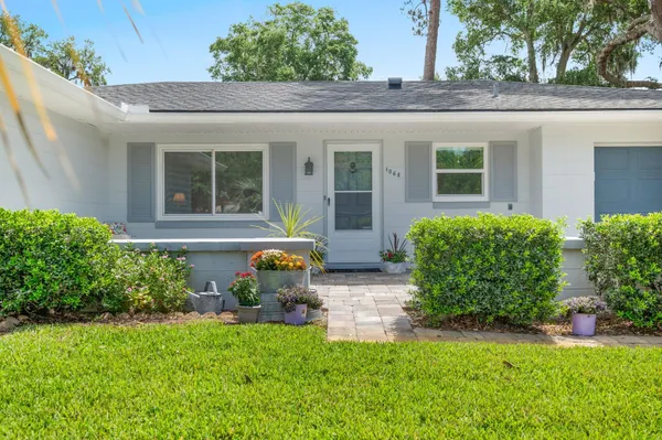 front view of a house with a yard