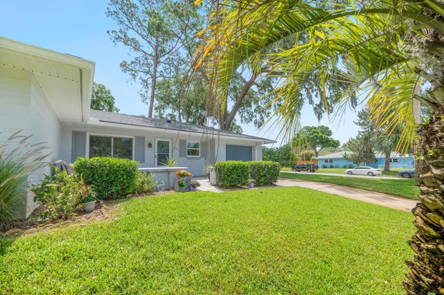 front view of a house with a yard