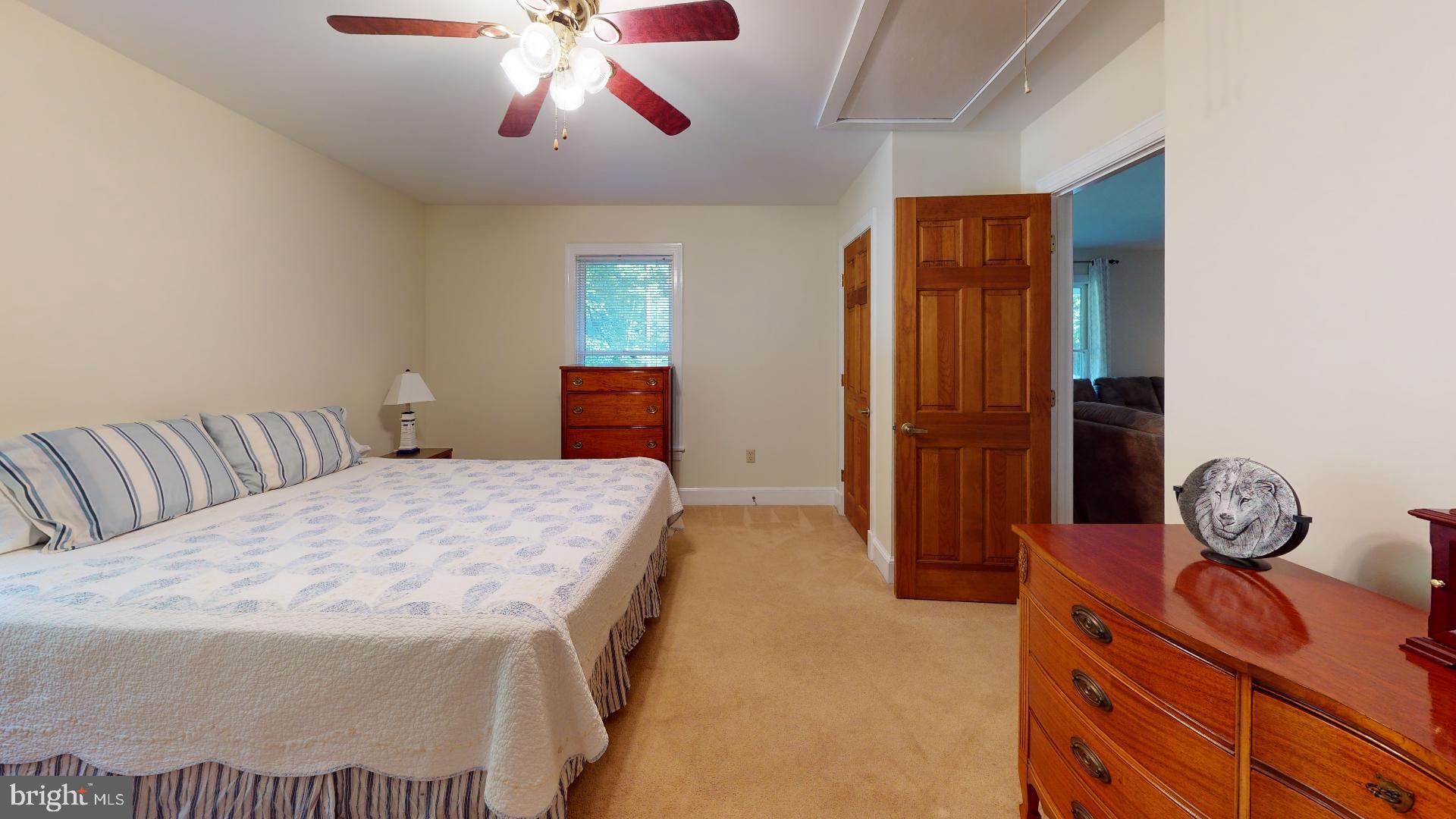 1055 Redeye Road Lusby, MD 20657 - Photo 11 of 38 Primary Bedroom with Ceiling Fan, Walk in Closet