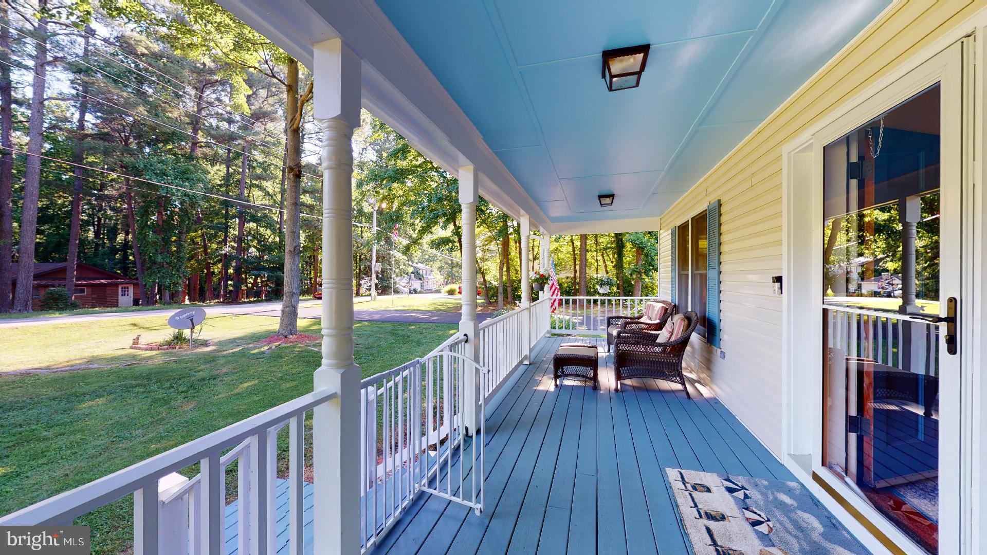 1055 Redeye Road Lusby, MD 20657 - Photo 29 of 38 Welcoming Front Porch over looks Level Front Yard