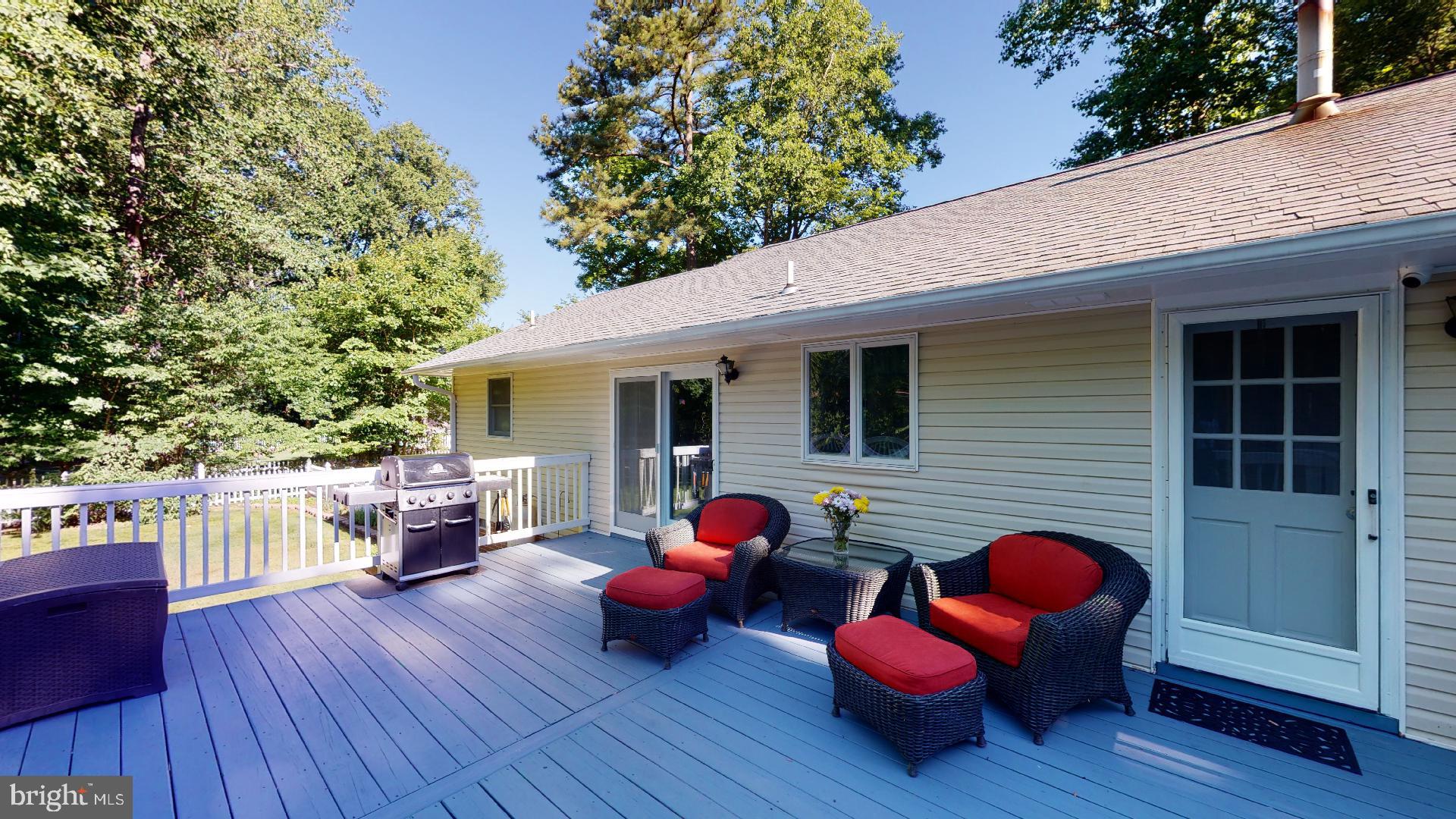 1055 Redeye Road Lusby, MD 20657 - Photo 34 of 38 Large, Wide Rear Deck Perfect for Entertaining